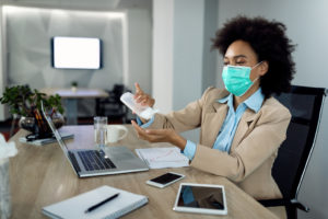 a person using sanitizer