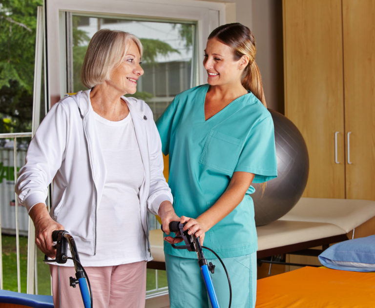 senior smiling with her nurse