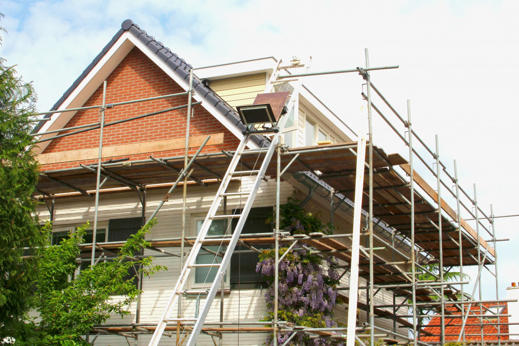 scaffolding around a house being renovated
