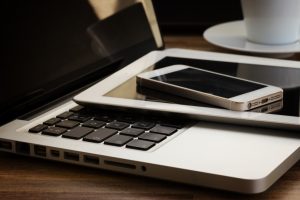 modern computer gadgets - laptop, tablet and phone close up, retro toned