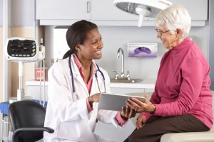 doctor showing patient her diagnosis