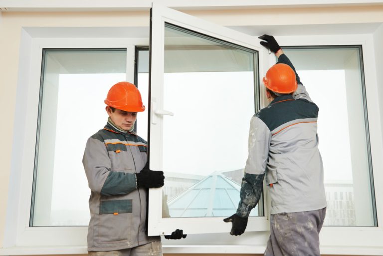 contractors installing a window
