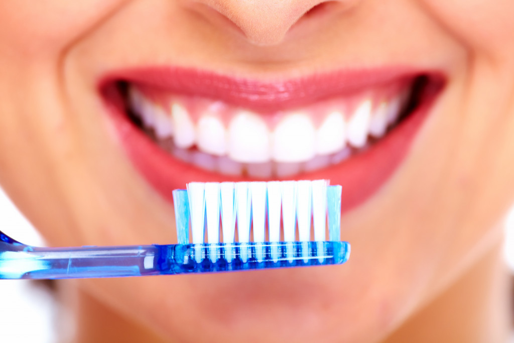 woman with toothbrush. Dental care background.