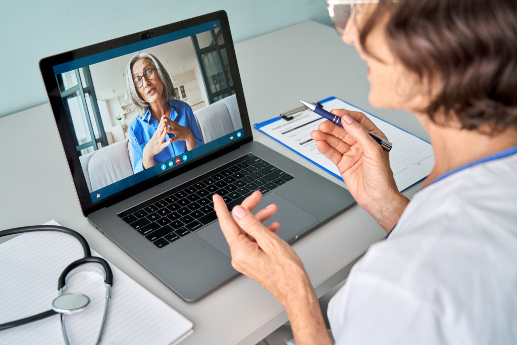 therapist on video call with a patient