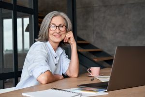 a woman in front of a computer