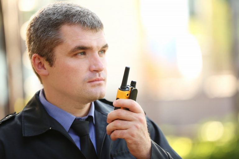 a male security guard using radio