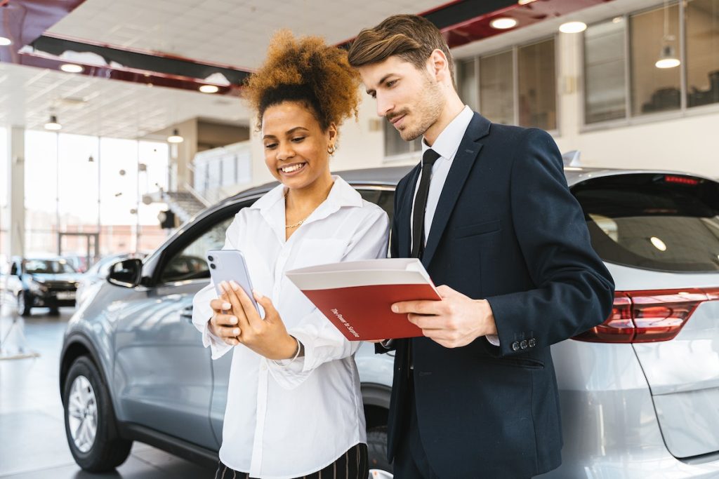 car dealer talking with a client