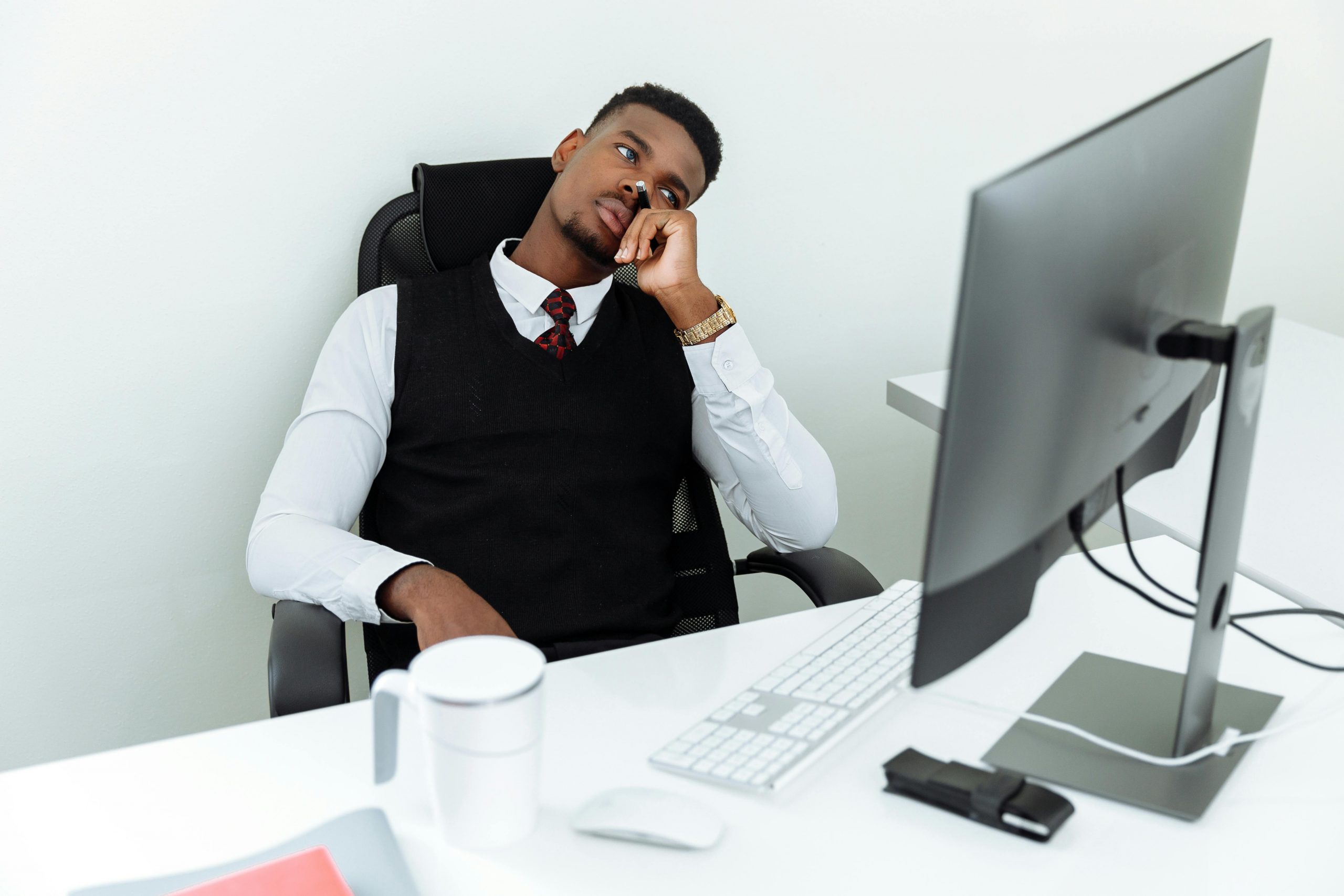 stressed employee glaring at the computer screen